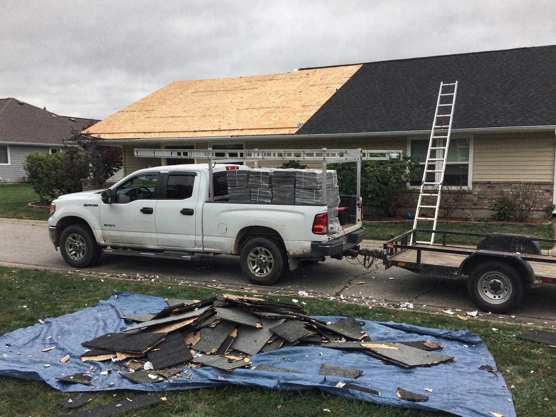 Roofing crew at work, early morning